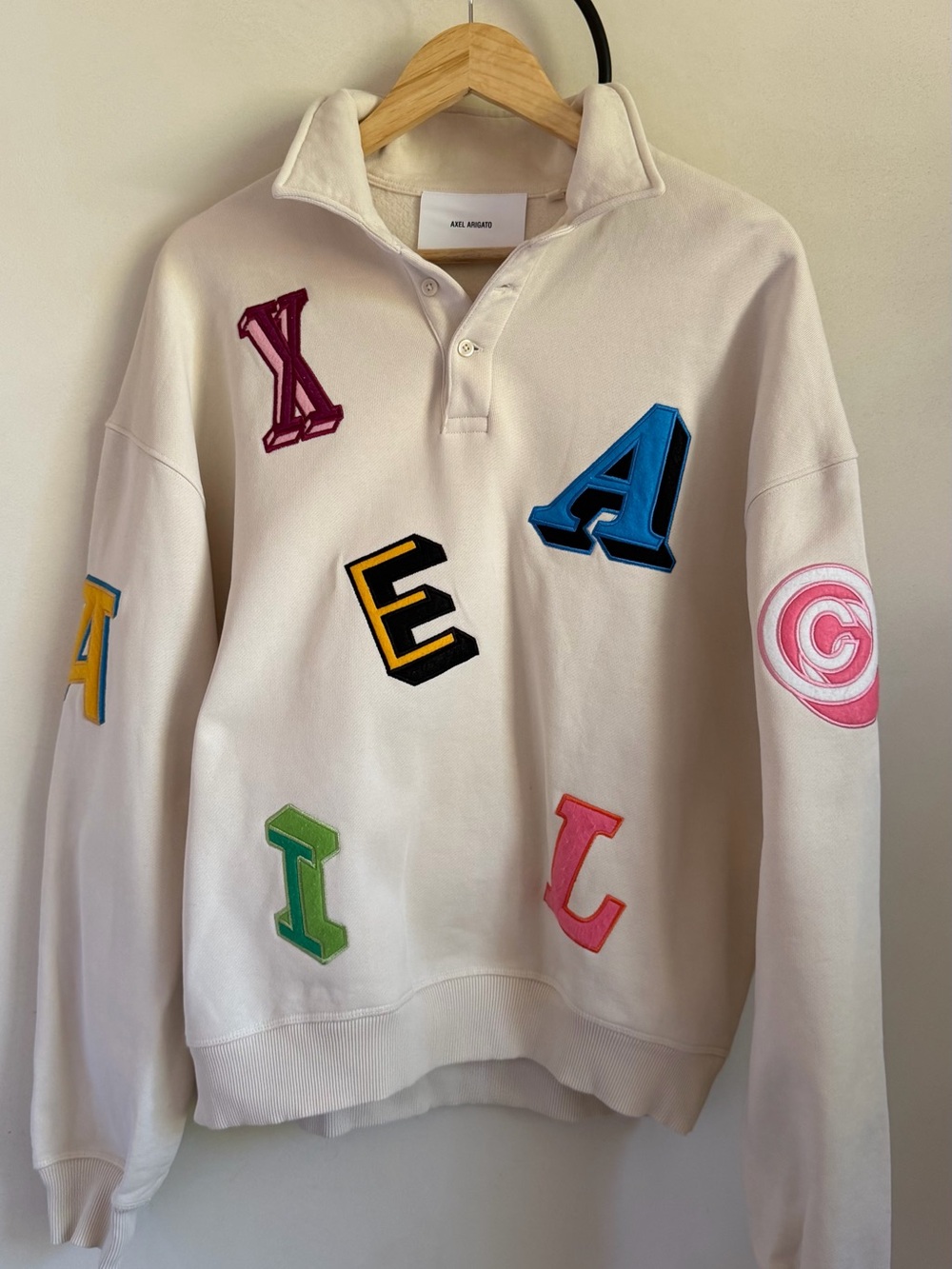 Axel Arigato Cream Rugby Pullover with Multicolor Letter Patches